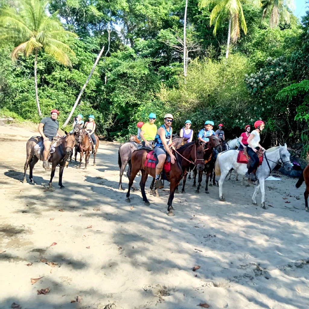 Traveler enjoying a guided horseback riding tour along forest trails and beaches in Drake Bay, Osa Peninsula, Costa Rica, with Osa Outdoors Adventures.